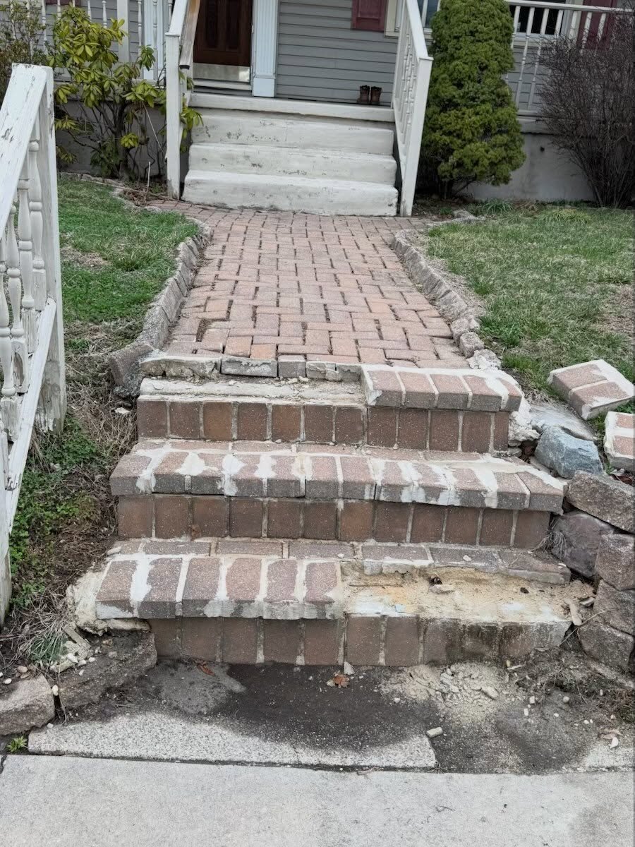 The failing brick paver walkway and crumbling steps before replacement, Glassboro, NJ