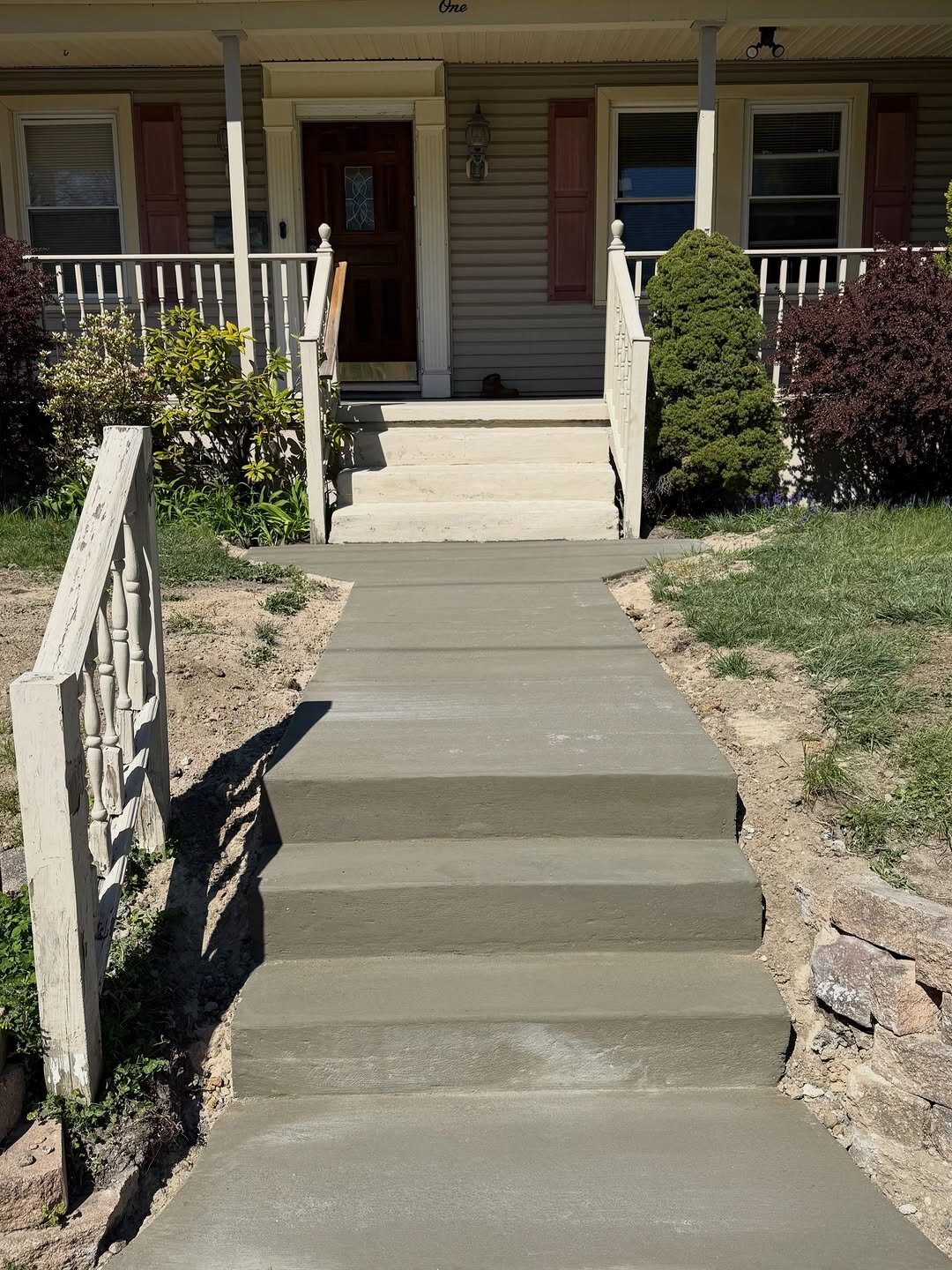 Paver-to-concrete walkway and three-step entrance replacement. Out with the old, in with the new… a safer, longer-lasting, refreshed look.
